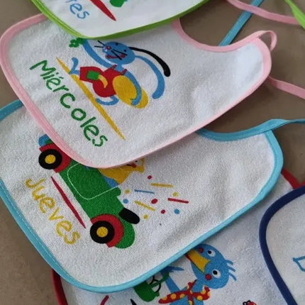 Pack 7 Hermosos Baberos Bebé 100% Impermeables Días Semana