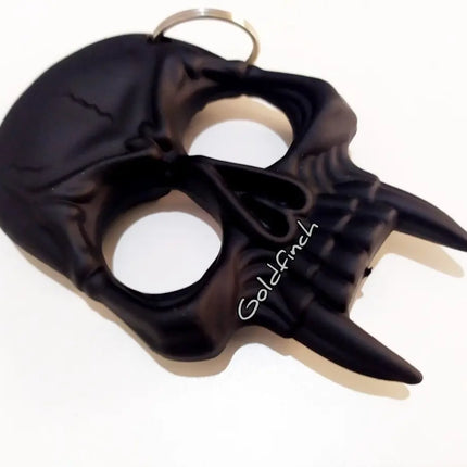 Manopla Llavero Calavera Negra 2 Puntas Defensa Personal