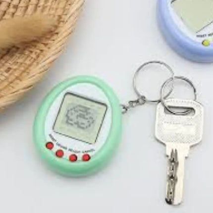 Tamagotchi Mascota Virtual Digipet Juego De Ingenio Llavero Morado